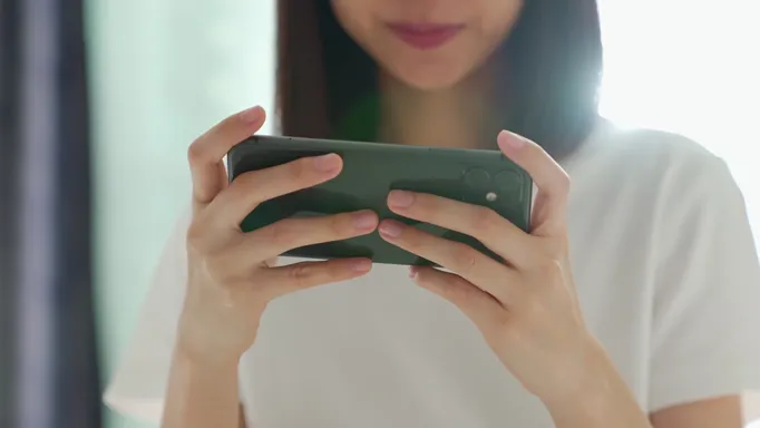 woman-playing-games-on-smartphone-free-video.jpg