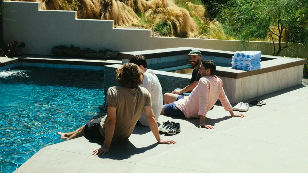 group sitting at a pool | pexels