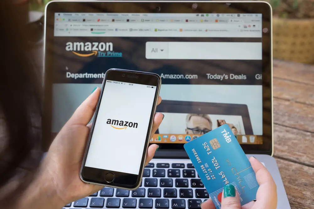 Laptop and Cell Phone showing Amazon web site
